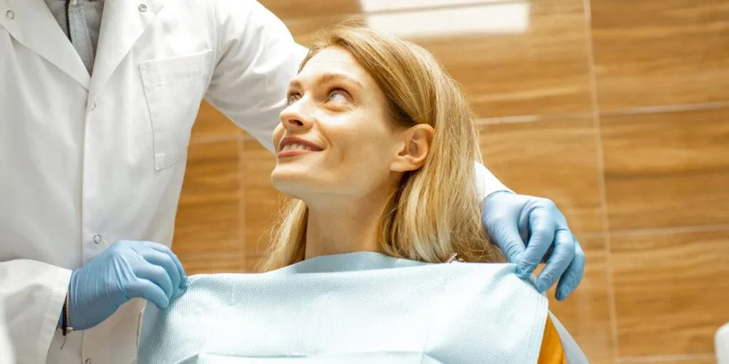 Dental hygienist attending to patient in North York